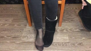 Student girl show nylon socks, boots and foot after study