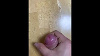 Slow motion cumshot on the table, handjob masturbation