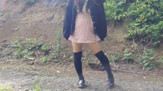 Japanese crossdresser pees openly in the forest for a selfie.