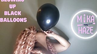 Blowing up black balloons