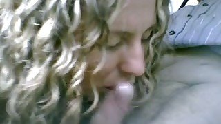 Curly hair milf lady in my car eating my dick on cam