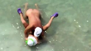 Mature couple sex in the sea