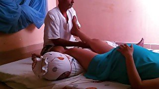 Pregnant woman getting leg massage