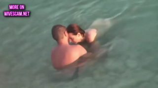 Mature couple sex in the sea