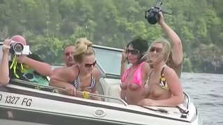 Nasty amateur girls sitting in a boat flash their boobs