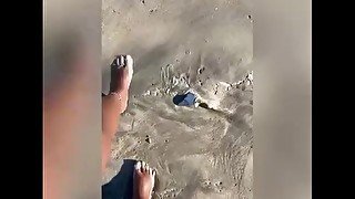 Sandy Feet On The Beach