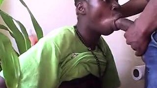 Horny black boy wraps his lips around a big white dick