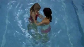 Two lesbians get dirty in a pool