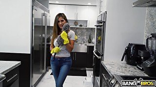 Busty woman stops cleaning around the house to pose nude