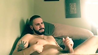 Bearded Scottish guy wanks his uncut cock and cums hard