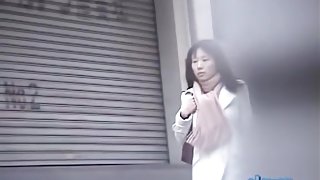 Cold Asian babe in a hurry gets a street sharking.