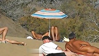 Slutwife masturbating for pervs in a beach