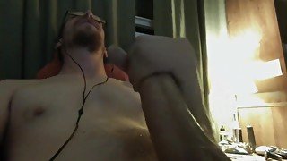 Guy watches porn and masturbates and shoots huge cum shot.