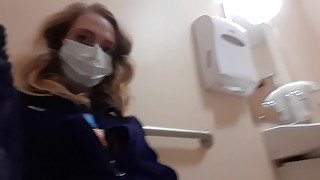 Milf in Northface Plays With Pussy In Public Bathroom