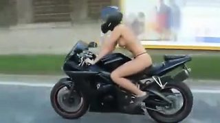 Topless Tattooed Chick Riding A Motorcycle