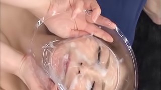 Flirtatious Japanese cowgirl takes a cum shower in a blazing bukkake action