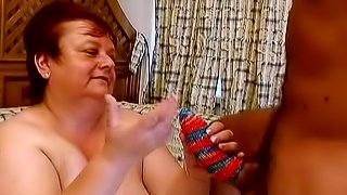 Fat granny Miranda plays with a cock before taking it in her ass