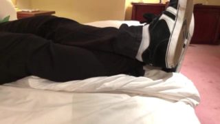 Male dress shoes, nikes, globes and white socks shoeplay in a nice hotel