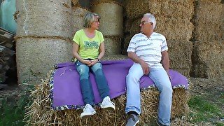 Mature lusty grey haired village slut wanks and sucks dick on straw in shed