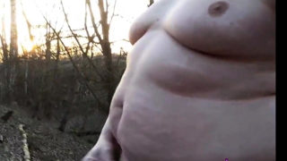 Chubby masturbates in the woods