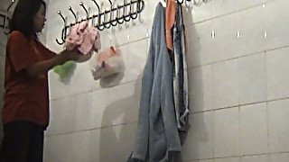 Cute brunette stranger girl in the locker room on hidden cam