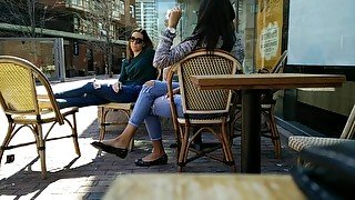 Two Delicious Brunettes Get Their Candid Feet Filmed At The Caffe