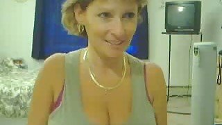 Short haired MILFie webcam nympho plays with her boobies for me