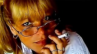 Cute smoking blonde in glasses