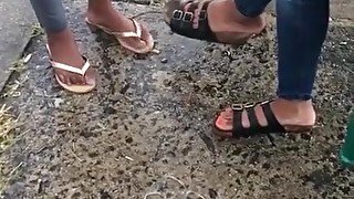 Orange toes at the bus stop