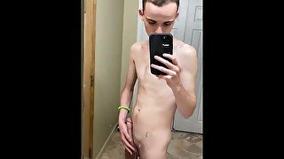 bored twink in a bathroom stroking thick cock