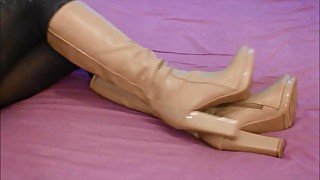 Squeaky Brown Boots on Bed