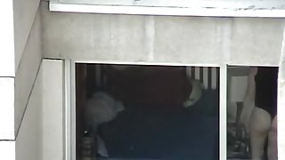 Opened window allows us voyeur babes ass in thong