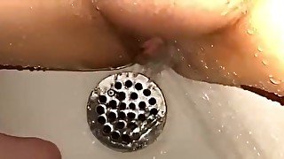 Throbbing clit orgasm in shower