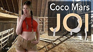 Coco Mars gives you a handjob in a barn