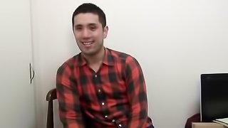 A fair guy with a pleated shirt jerks off pretty heavily while sitting on a chair