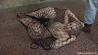 Obedient bitch sits stranded in fishnet and ready to fuck