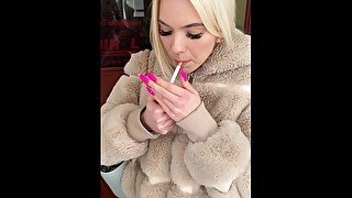 A nice teen is smoking and spitting loogies