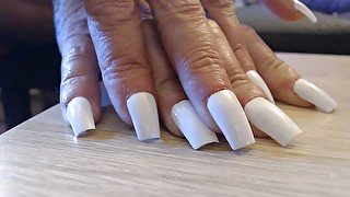 Tapping clicking white fingernails