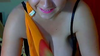 Chubby brunette milf shakes her oiled tits in front of a webcam