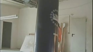 Hawt dark brown is punching bag naked and then masturbates