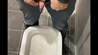 Man peeing in toilet