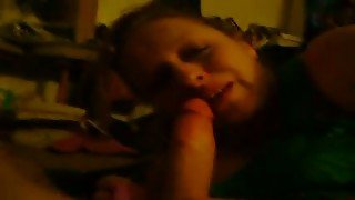 Mature slut with wrinkled face closes her eyes while giving a blowjob