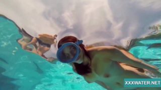 Hot brunette slut Candy swims underwater