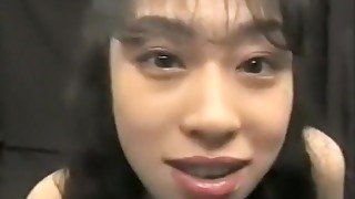 Two frisky Asian girls enjoy tasting a guy's cum in each other's mouth