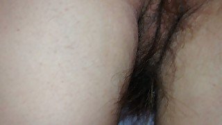 Stroking her pubic hair on her ass and pussy.