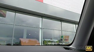 Likable slutty chick bows and gives driving a car dude a good blowjob