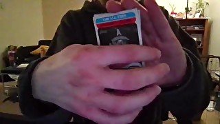 Cute Nerd Opening a Pack of Trading Cards