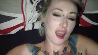 Tattooed chick takes a facial.