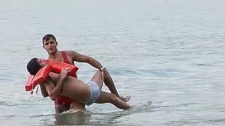 Rubbing his boyfriend's face with his throbbing manhood at the beach