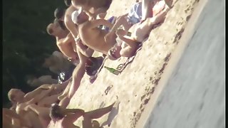 Naked tourists caught on beach spy cam relaxing and enjoying nudity